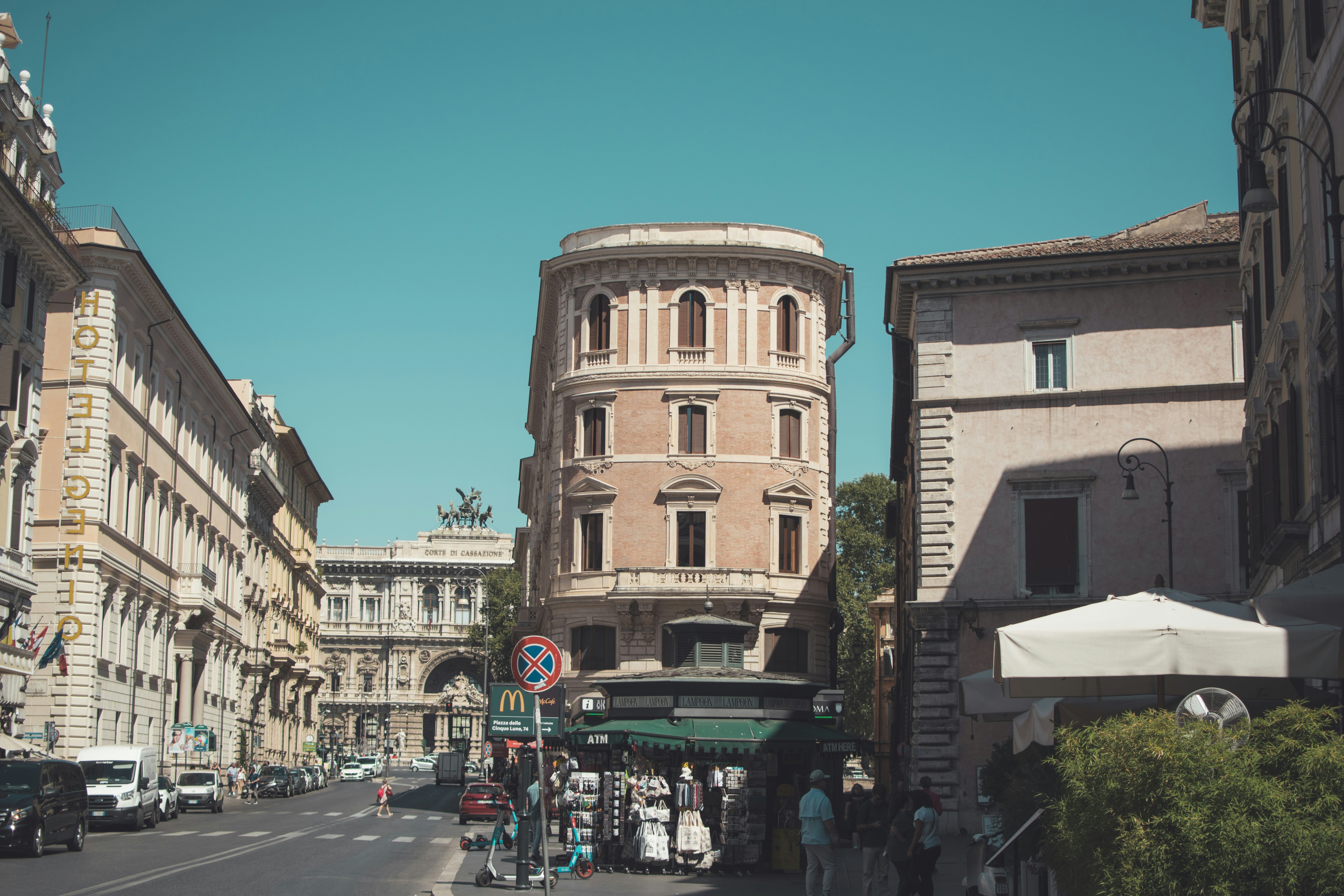 a city street with cars and people on it, Streets of Rome