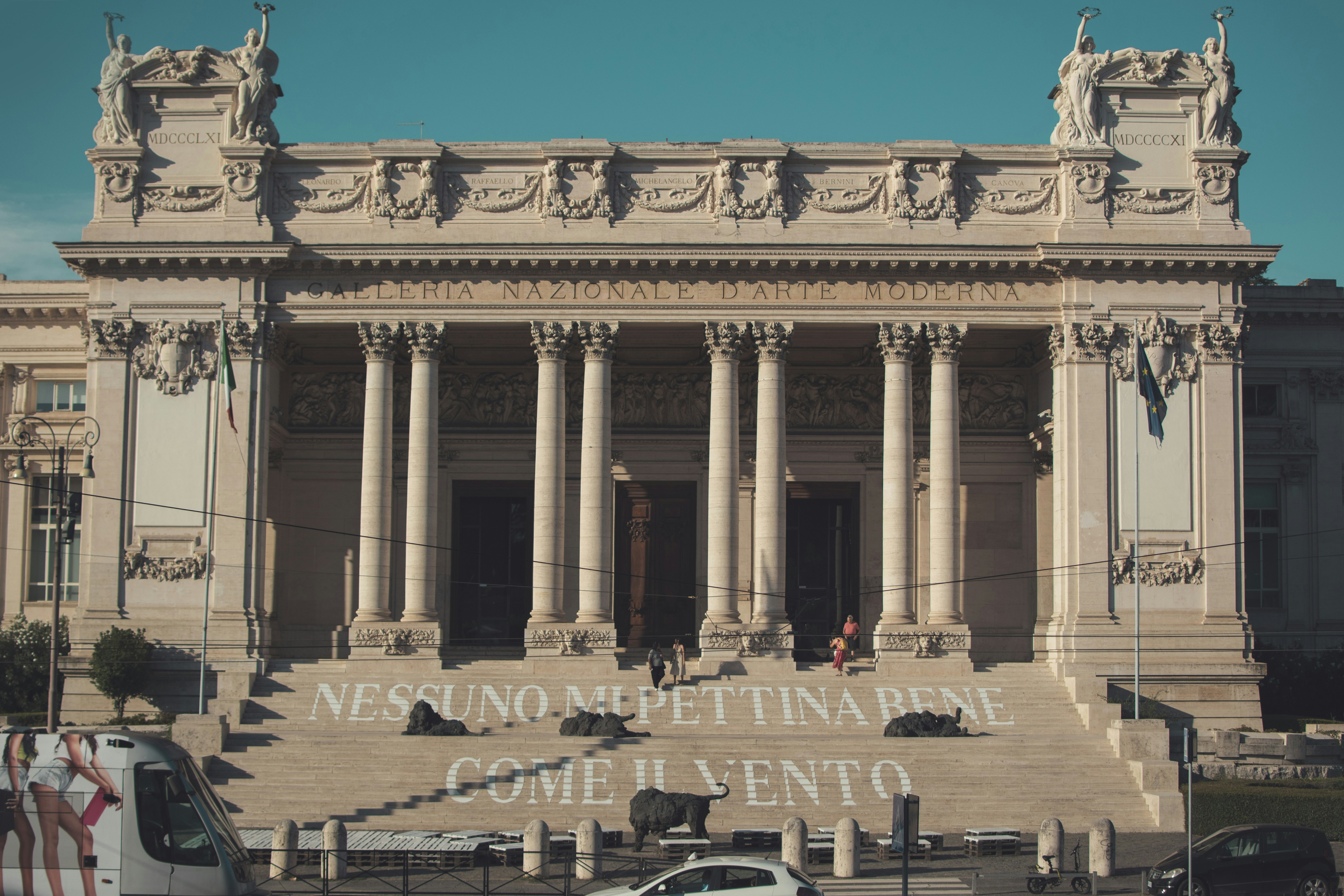 a car parked in front of a large building, Galleria Nazionale d
