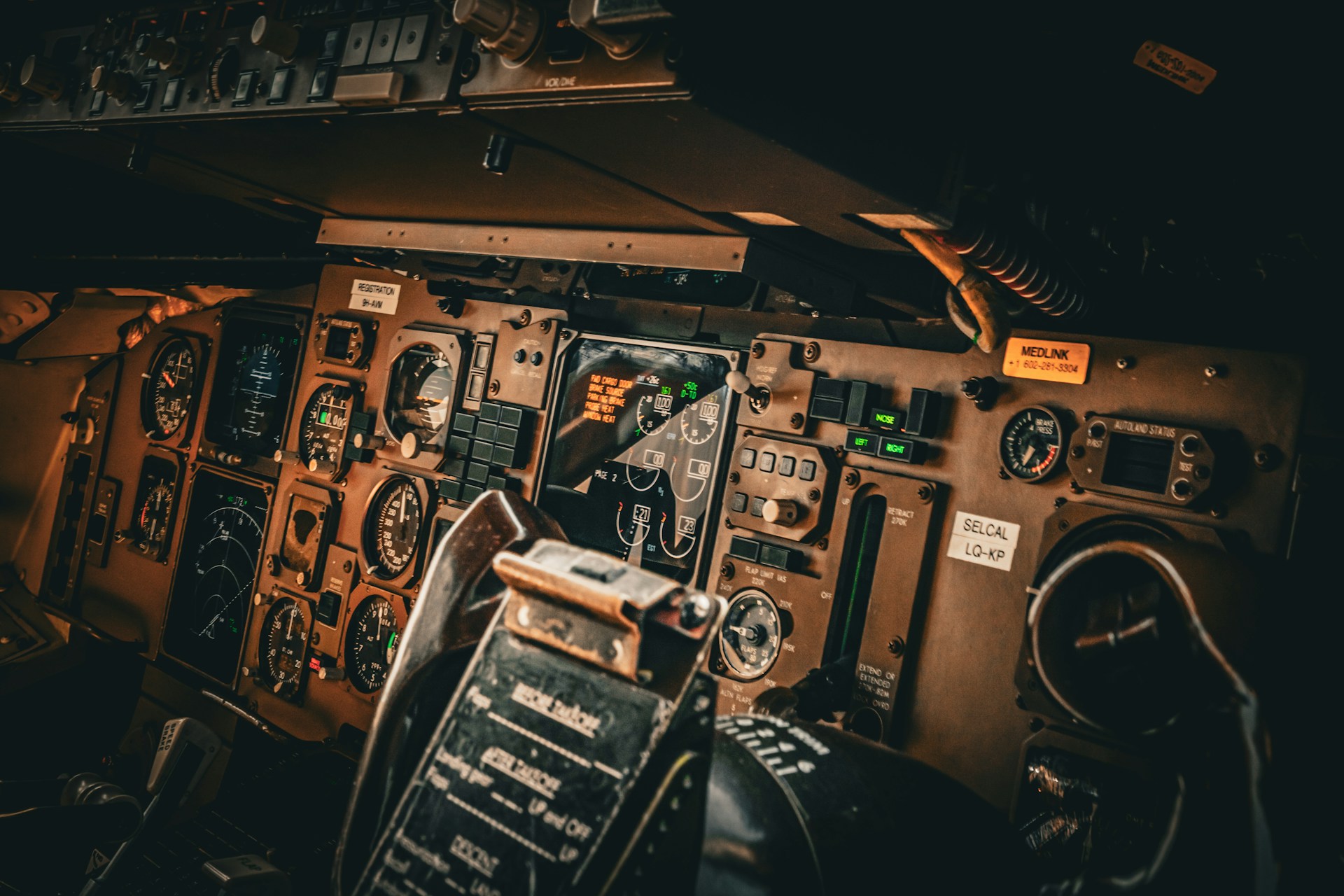 the cockpit of an airplane with many controls