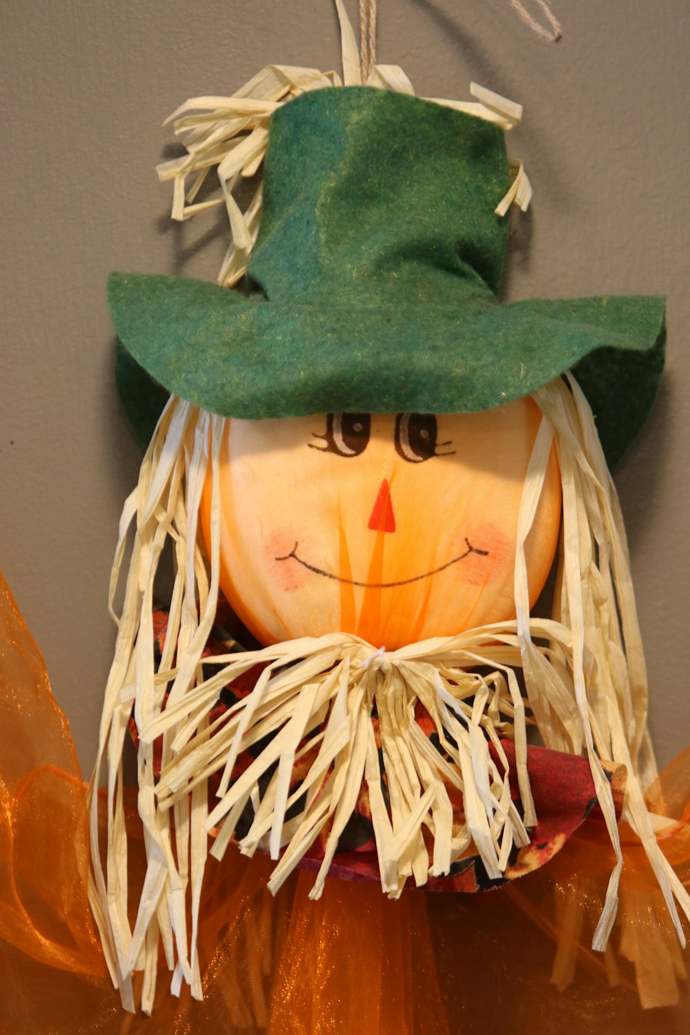 a pumpkin with a green hat on top of it