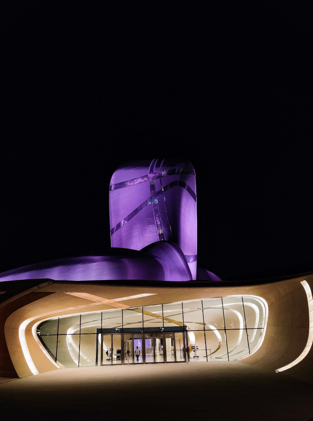 a building that has a large purple object on top of it
