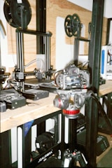 a group of machines sitting on top of a wooden table
