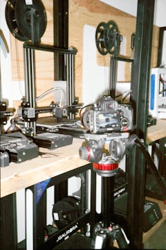 a group of machines sitting on top of a wooden table