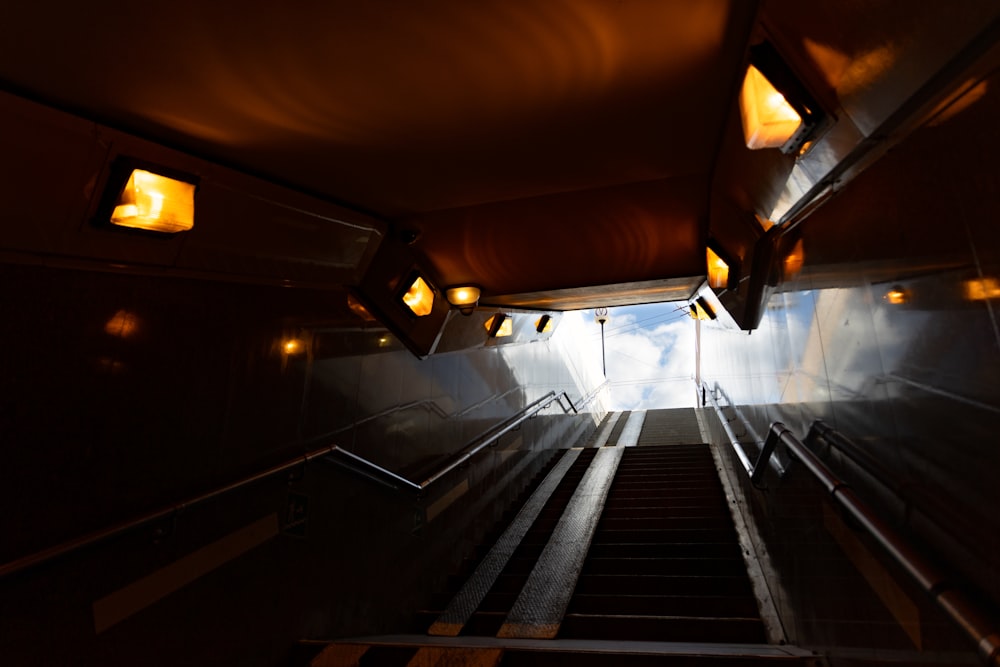 a set of stairs leading up to a skylight