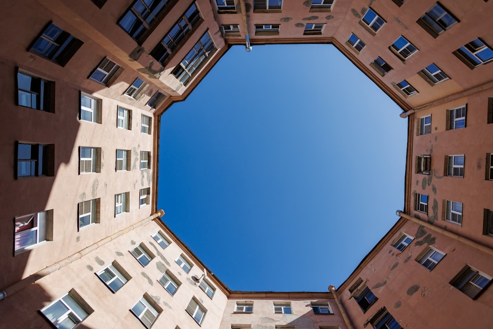 looking up at a group of tall buildings