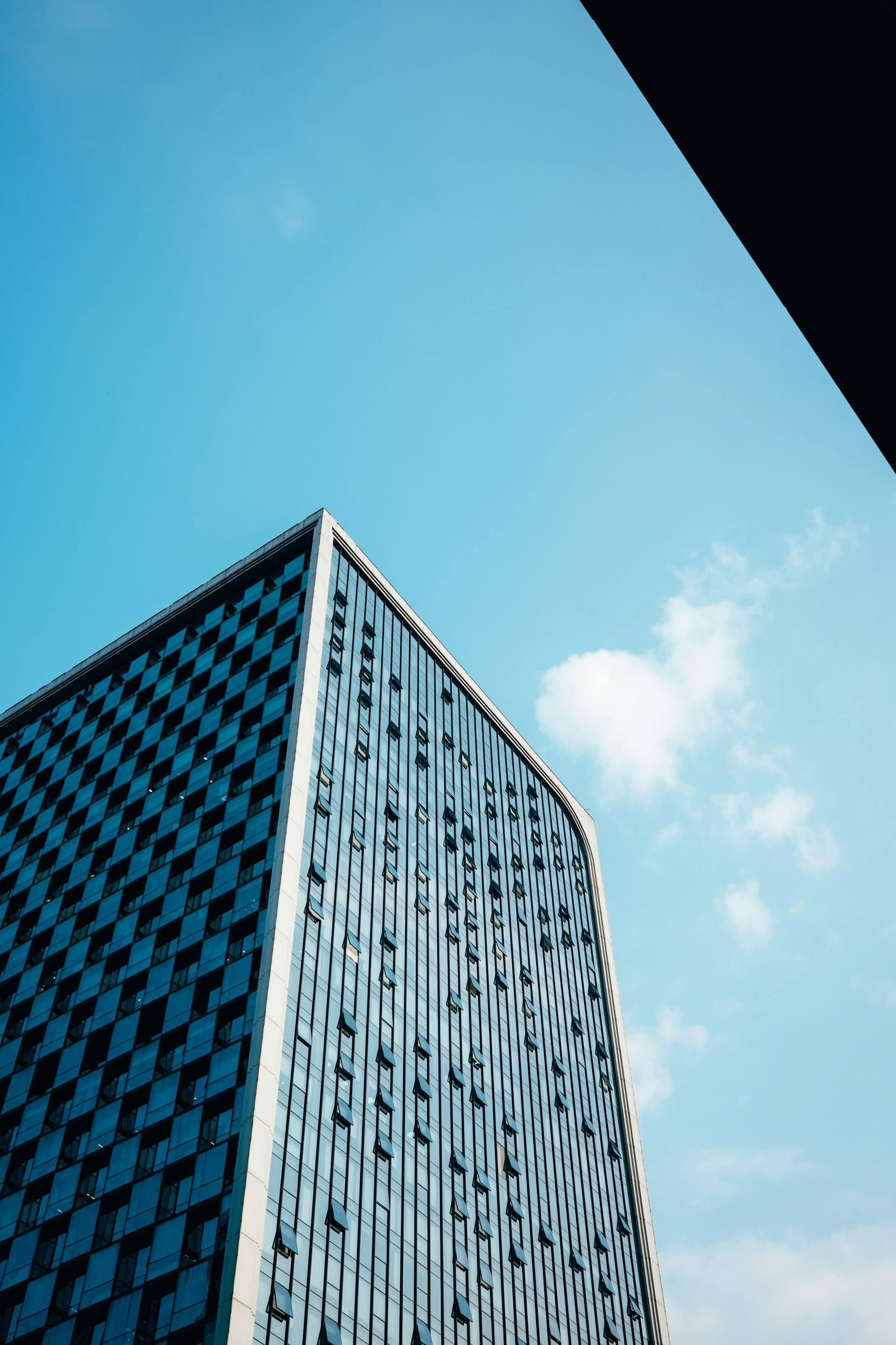 a tall building with a sky background