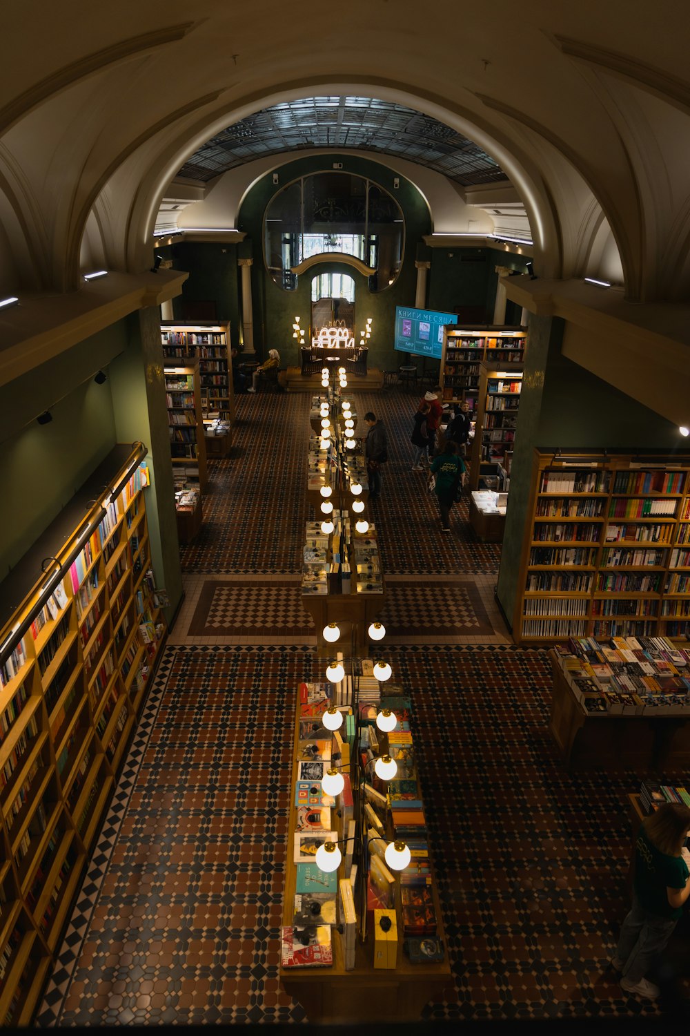 a library filled with lots of books and lots of lights