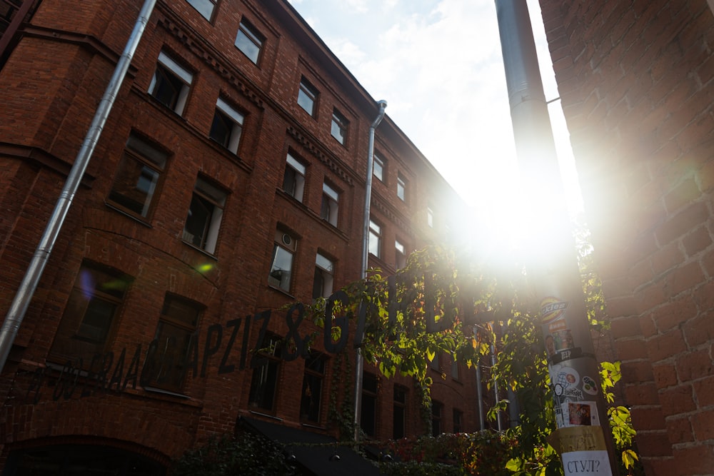 the sun shines brightly through the windows of a brick building