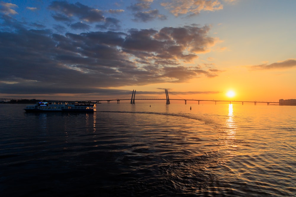 a boat traveling across a large body of water