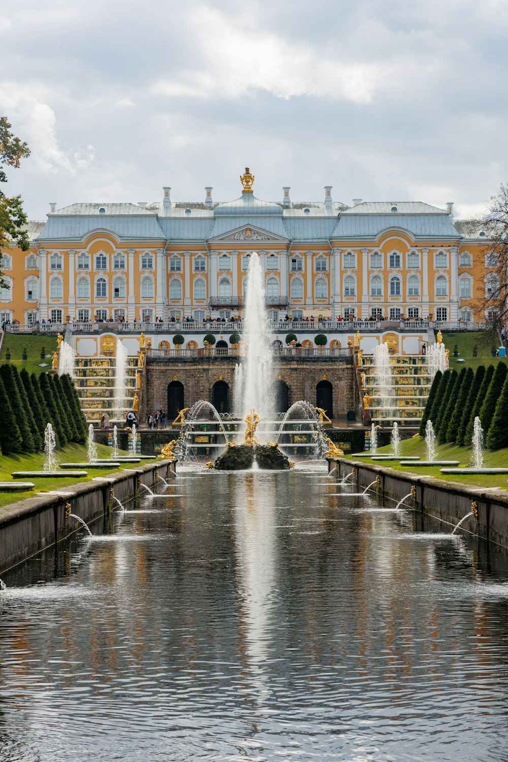 a large building with a fountain in front of it