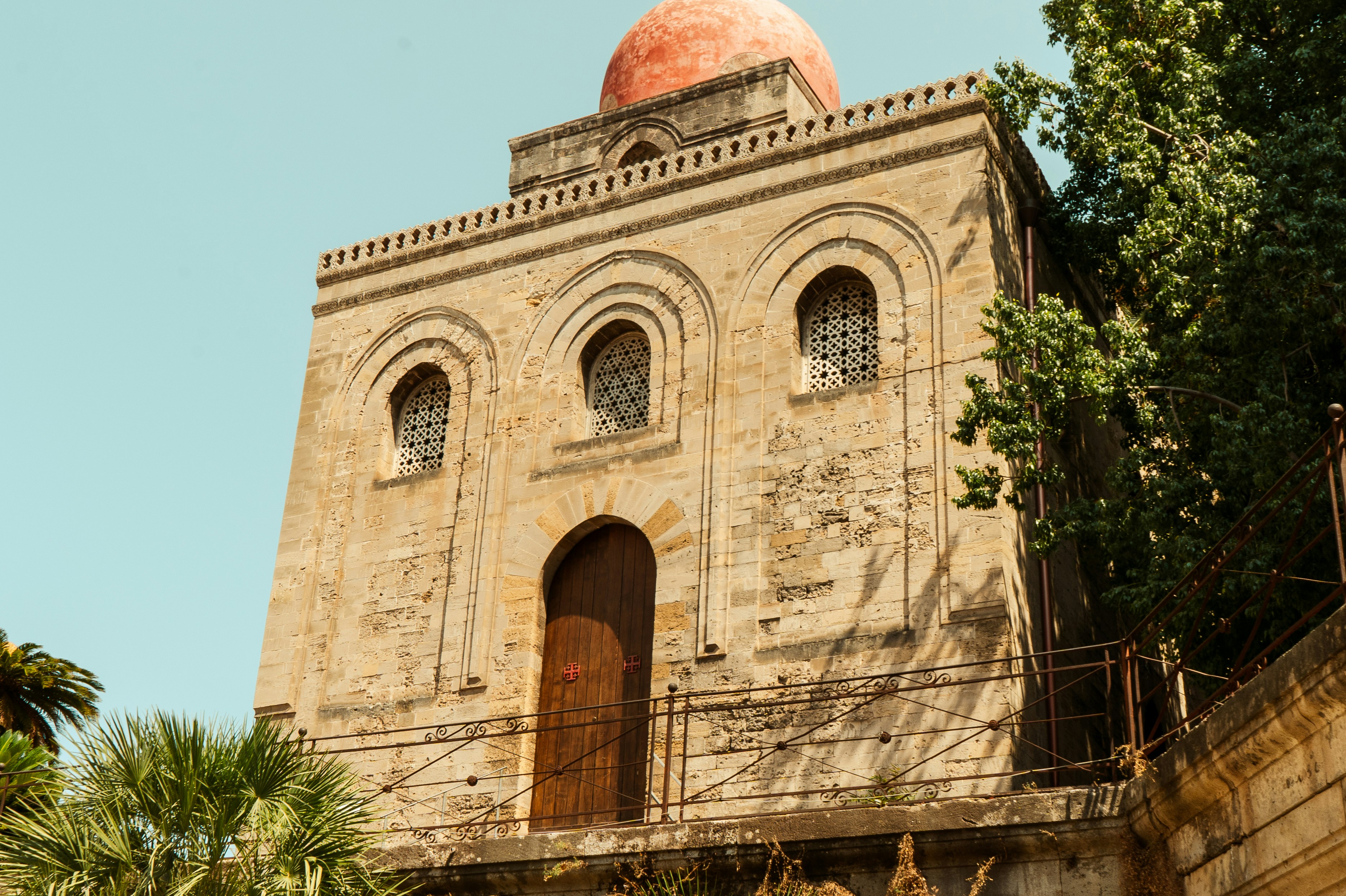 an old building with a red dome on top