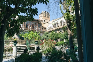 Quiet courtyard garden surrounded by classic Paris apartments.