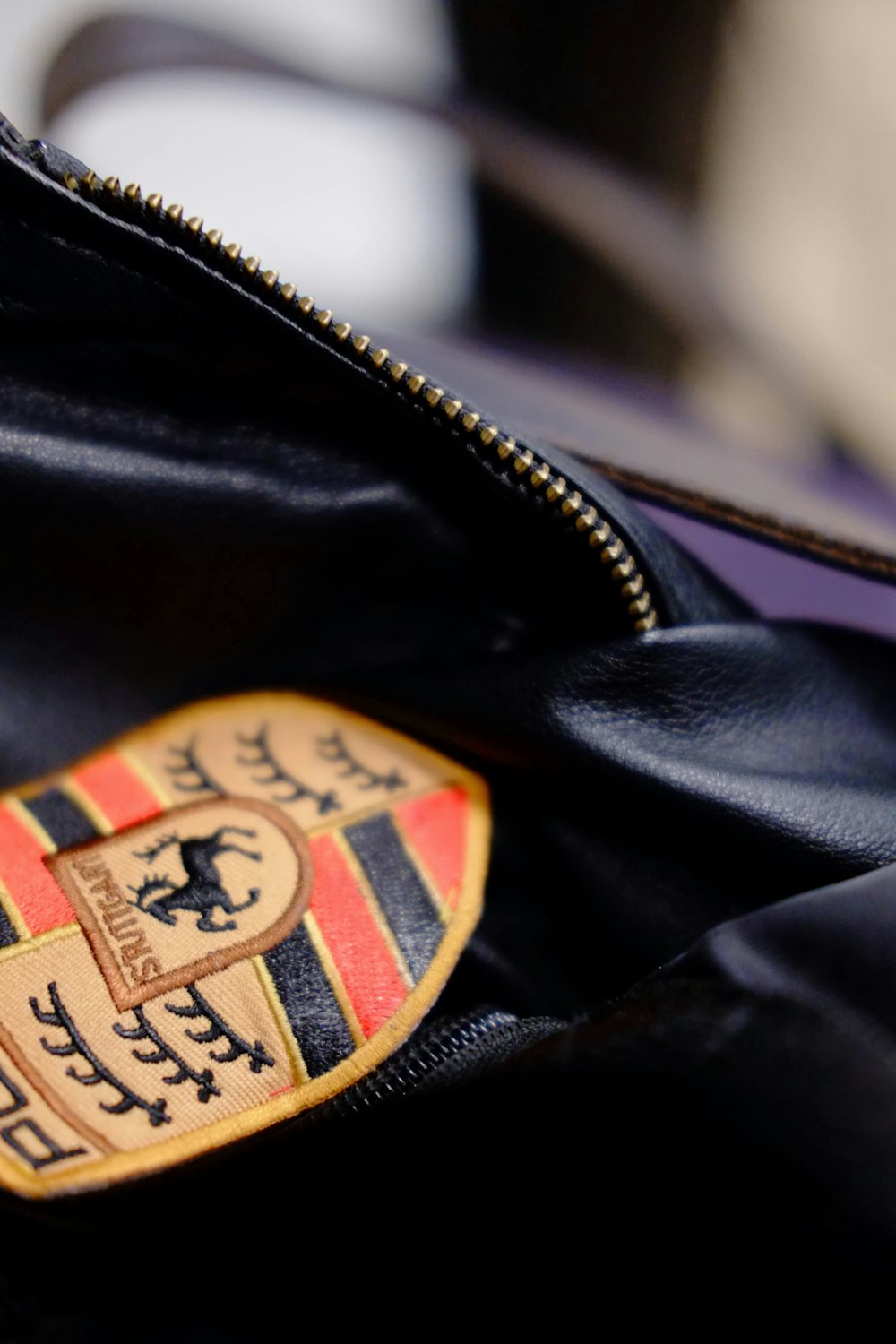 a close up of a bag with a crest on it