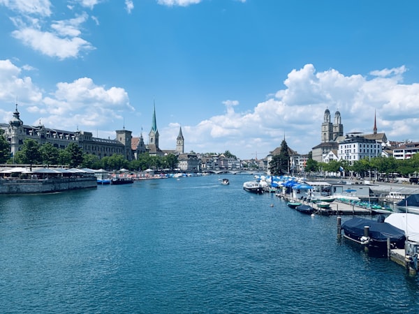European harbor town with colorful boats at sunset