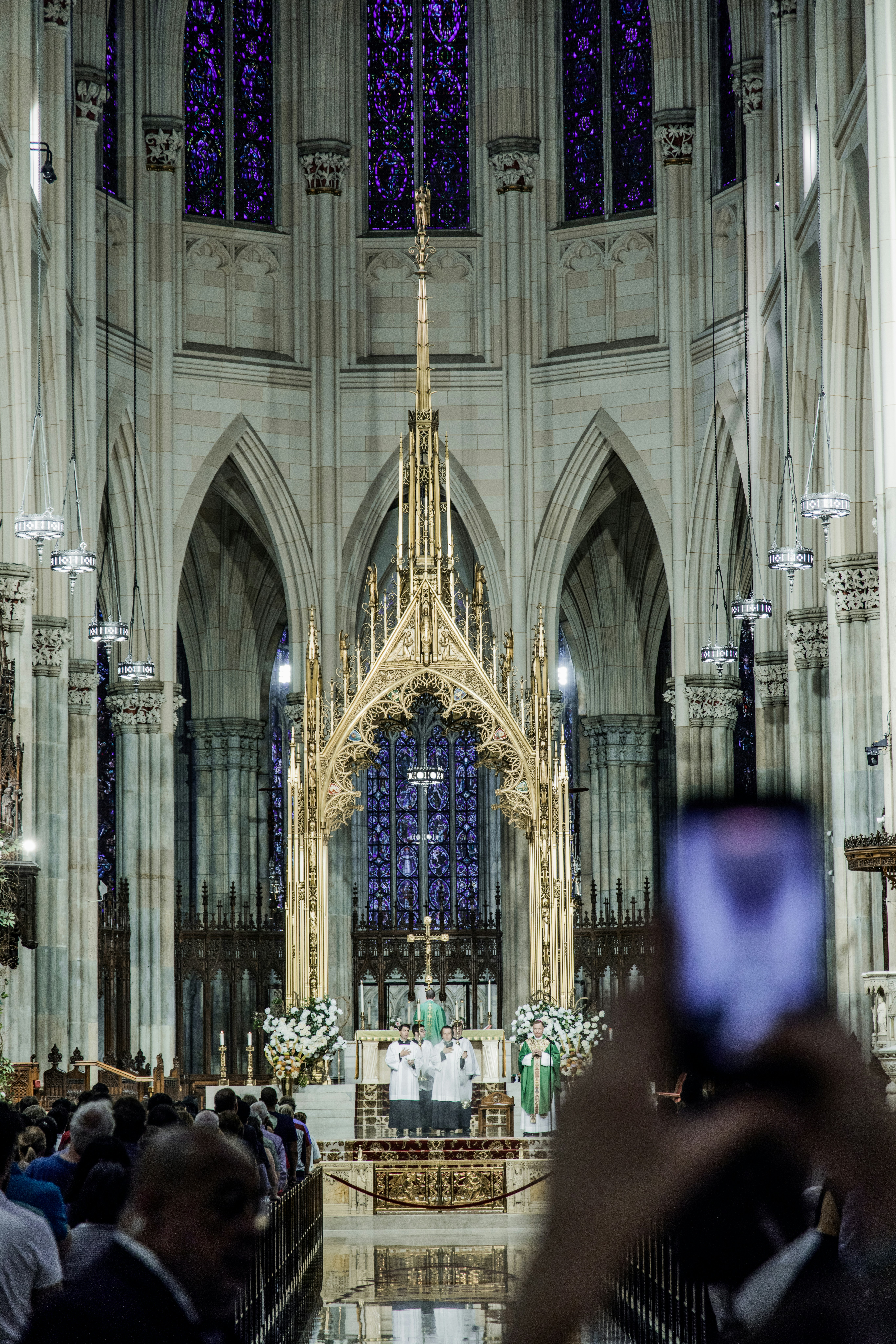 a person taking a picture of a cathedral