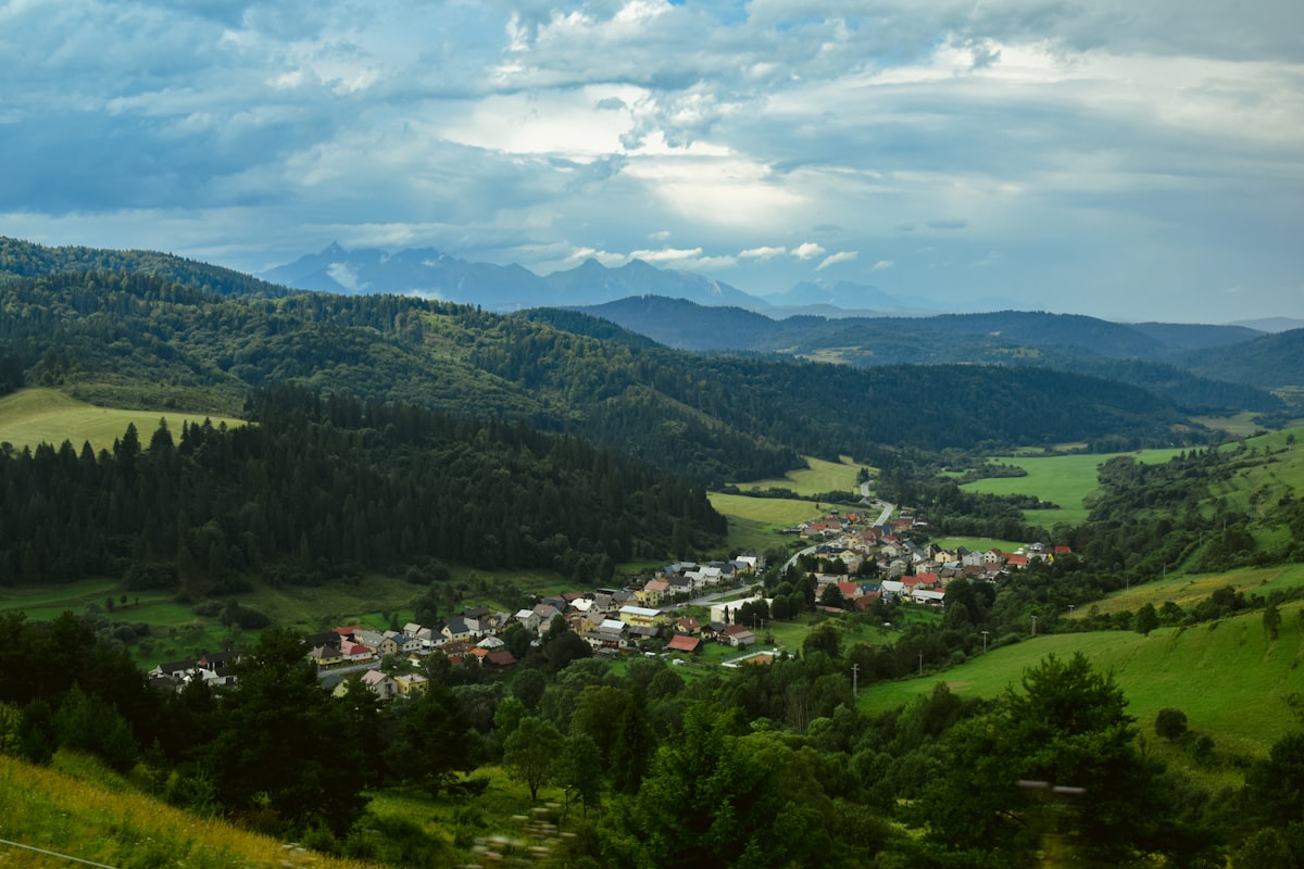 a view of a small town in the mountains
