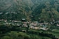 a small village nestled in a valley surrounded by mountains