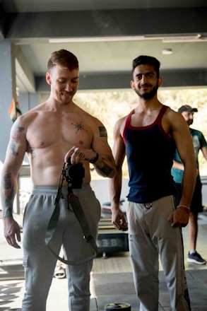 a couple of men standing next to each other