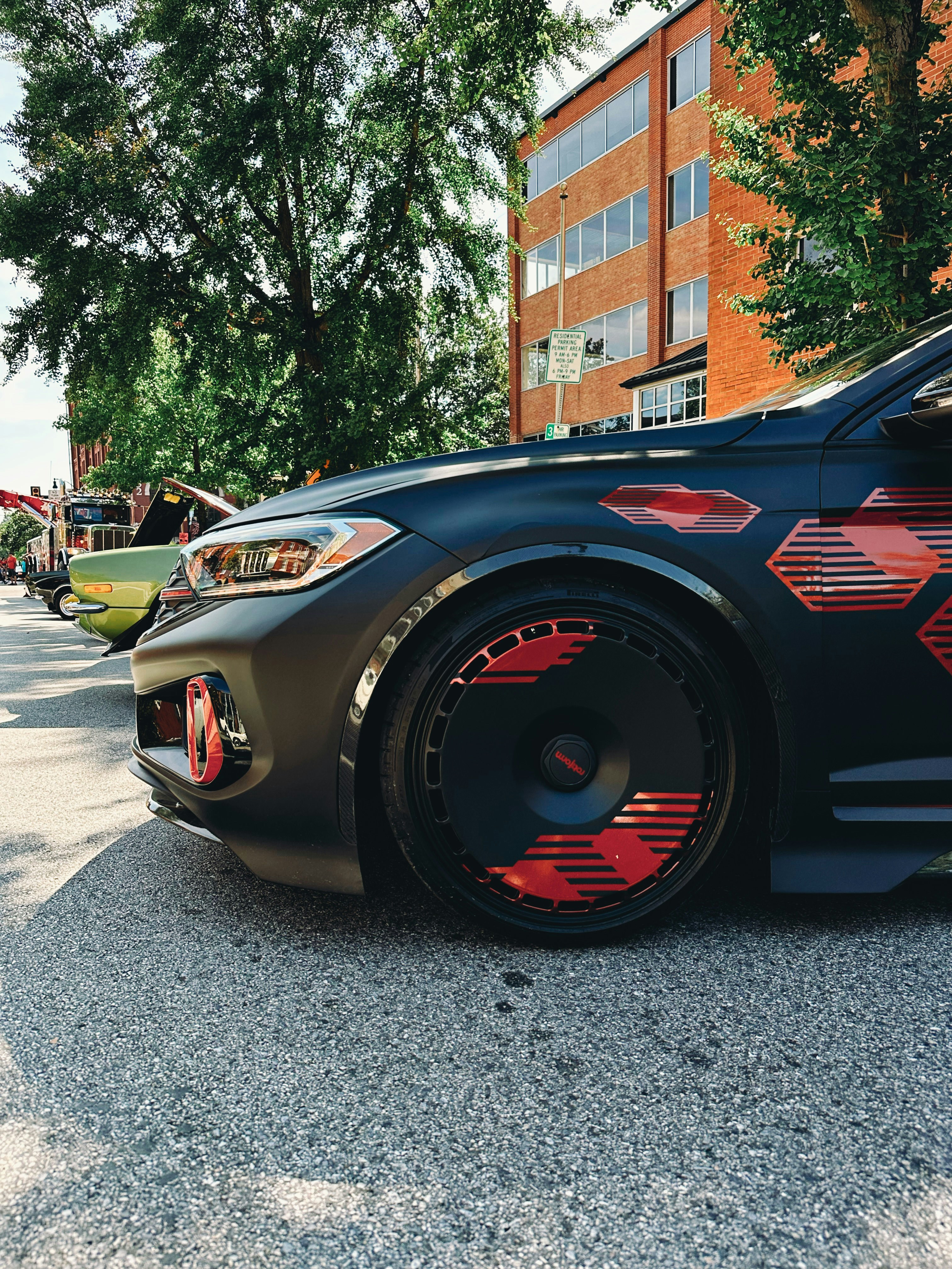 a black sports car parked on the side of the road