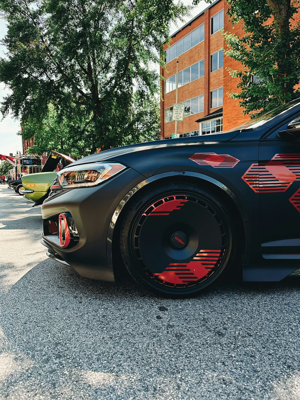 a black sports car parked on the side of the road