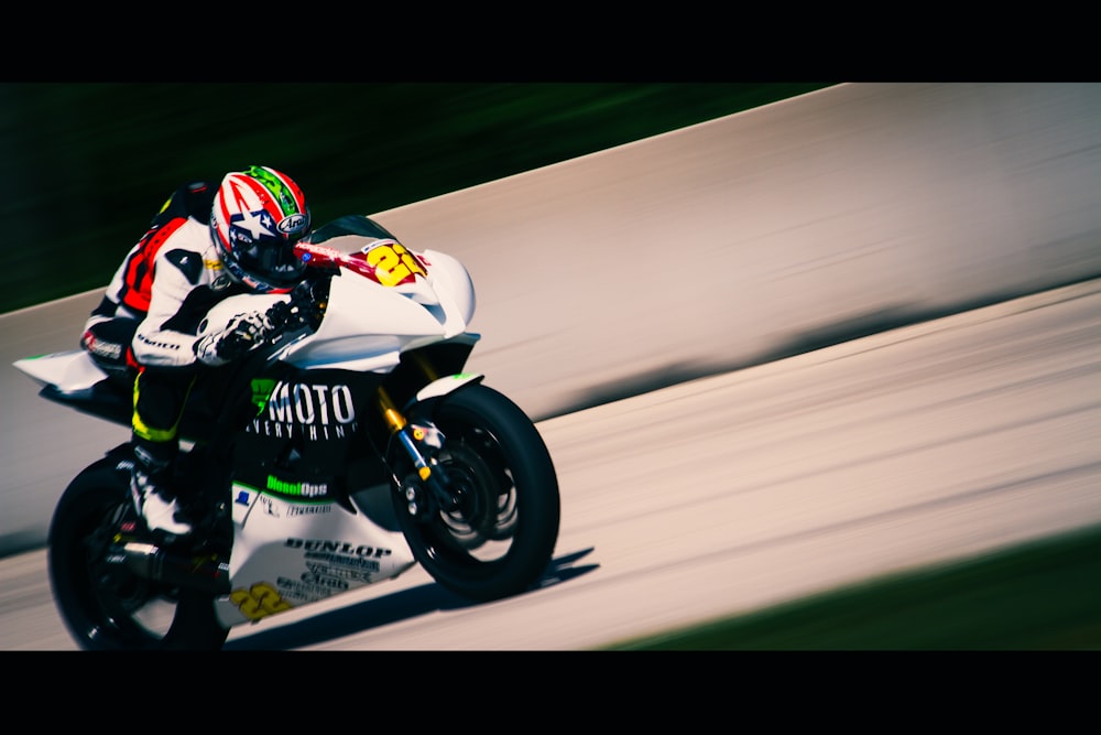 a person riding a motorcycle on a race track