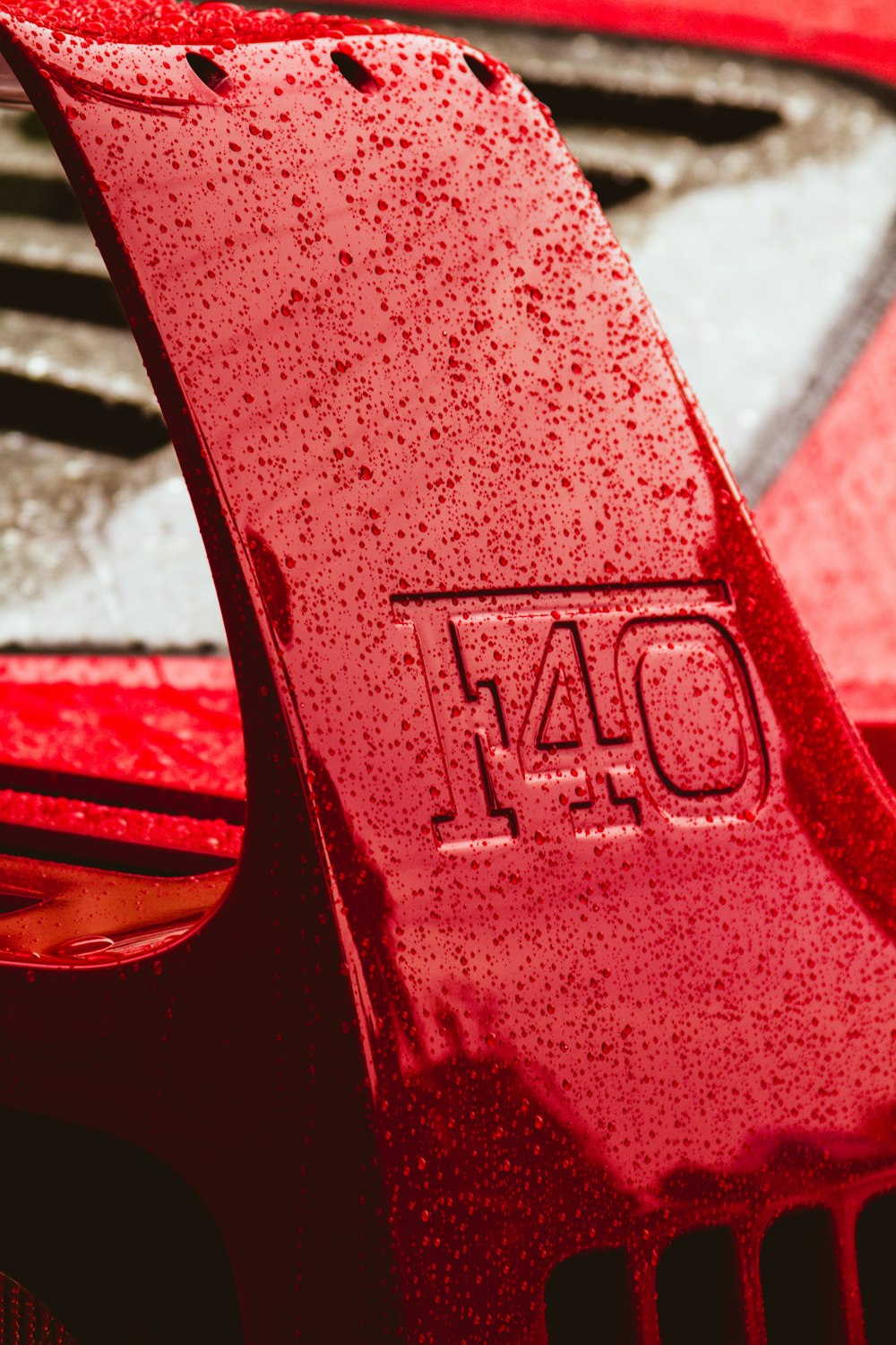 a close up of the hood of a red car