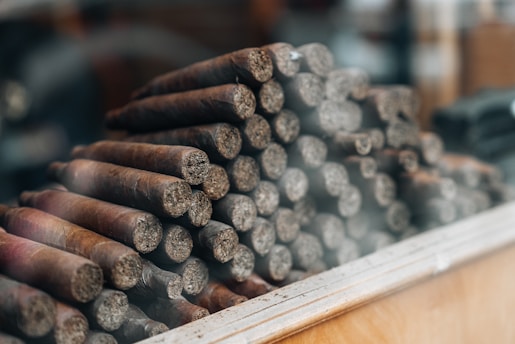 a pile of cigars sitting on top of a table