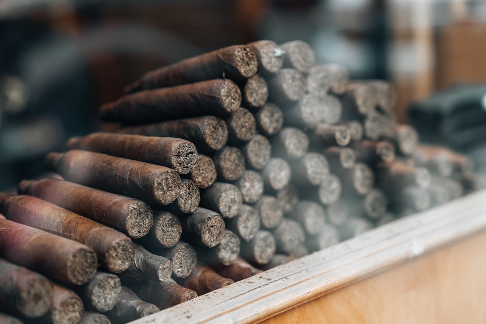 a pile of cigars sitting on top of a table