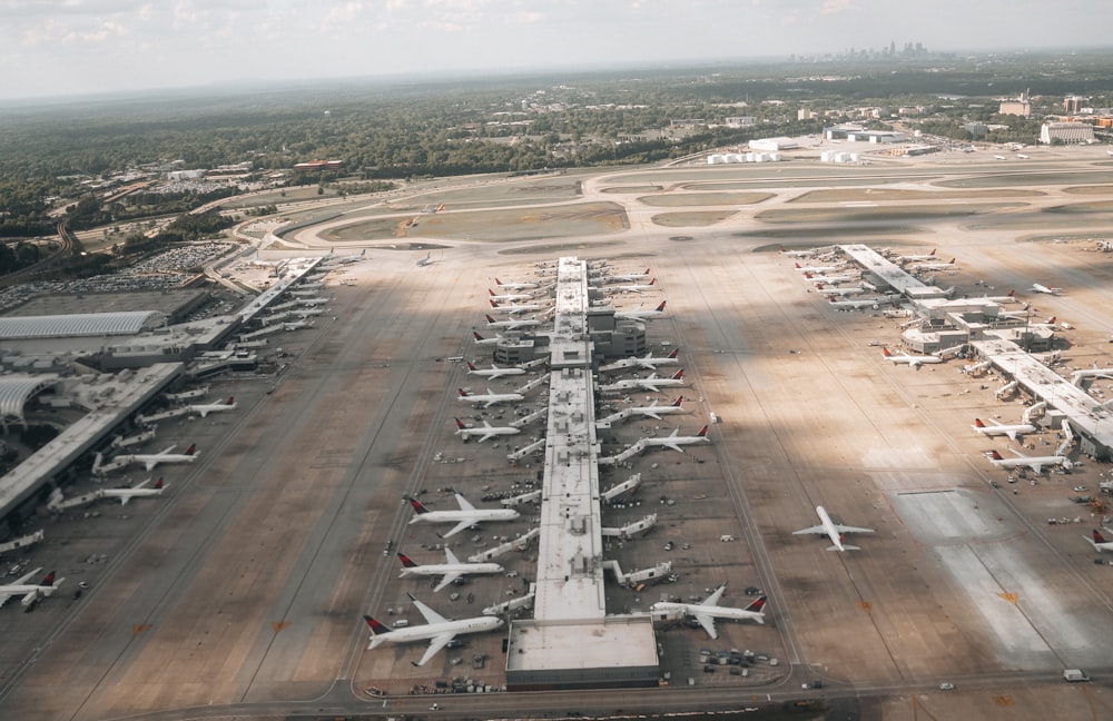 an aerial view of an airport with many planes