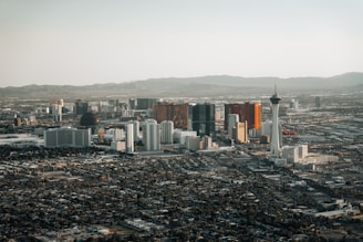 an aerial view of a city with tall buildings