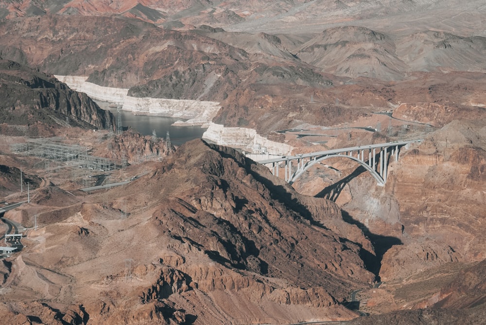 an aerial view of a bridge over a canyon