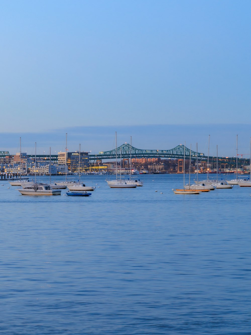 a group of boats floating on top of a body of water