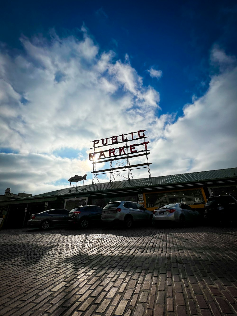 a parking lot with cars parked in front of it