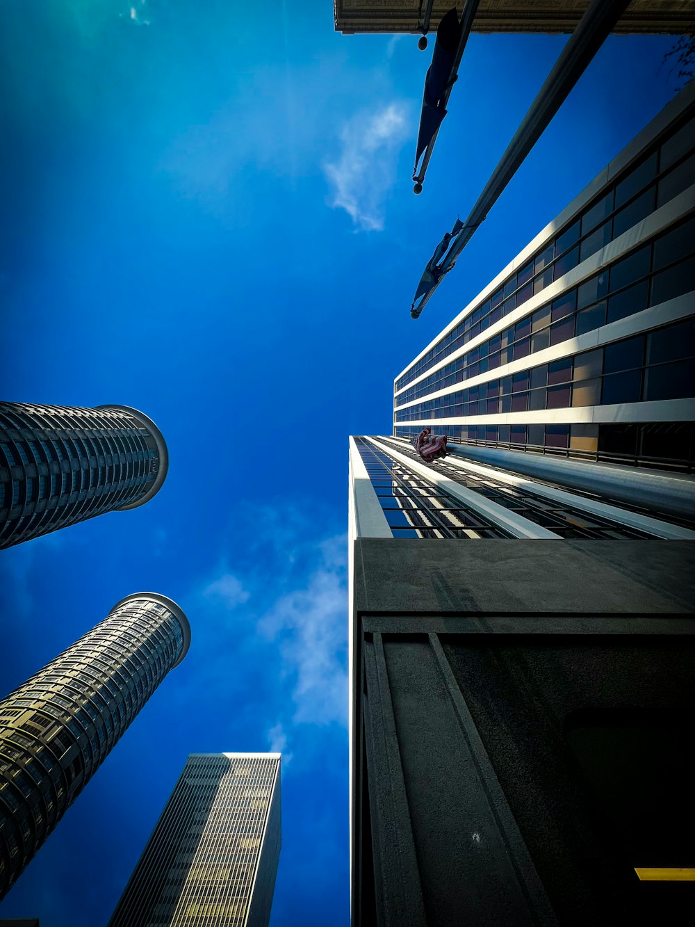 looking up at tall buildings in a city