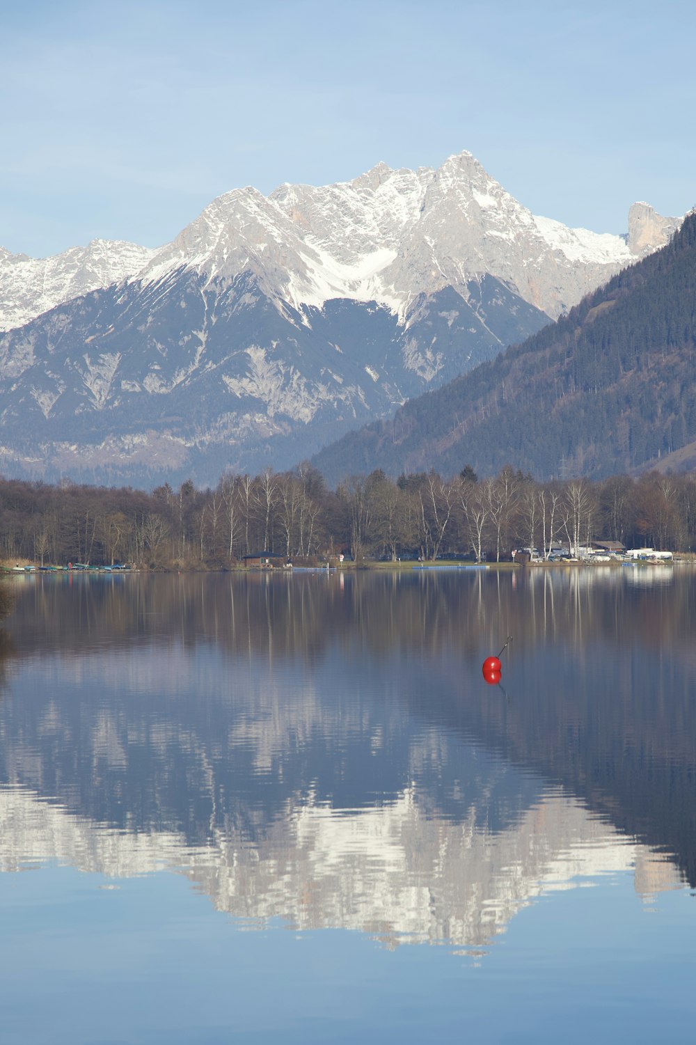 a large body of water with mountains in the background