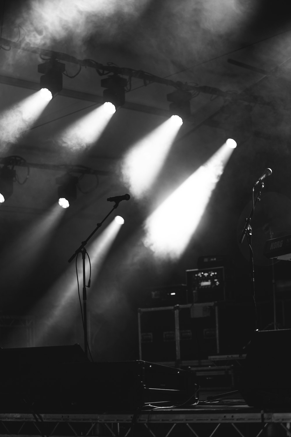 a black and white photo of a stage with lights
