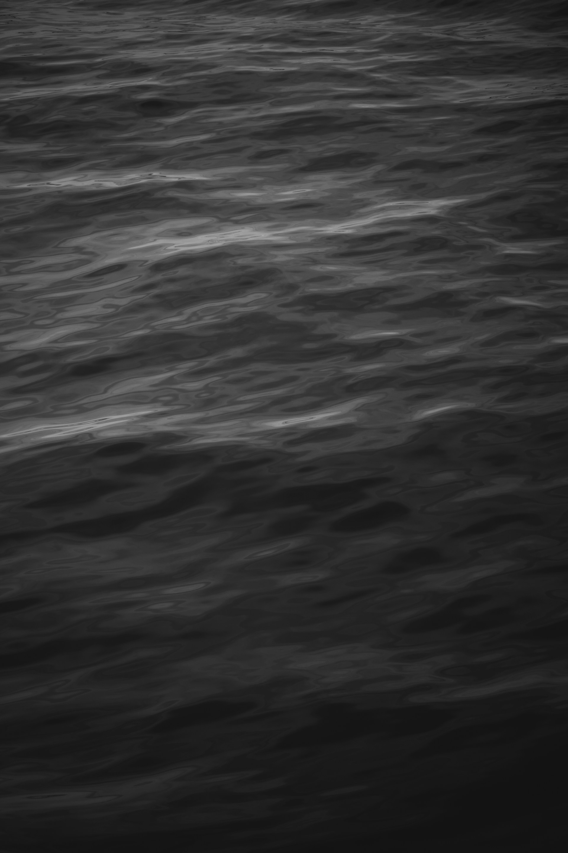 a black and white photo of a body of water