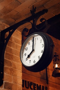 a clock hanging from the side of a building
