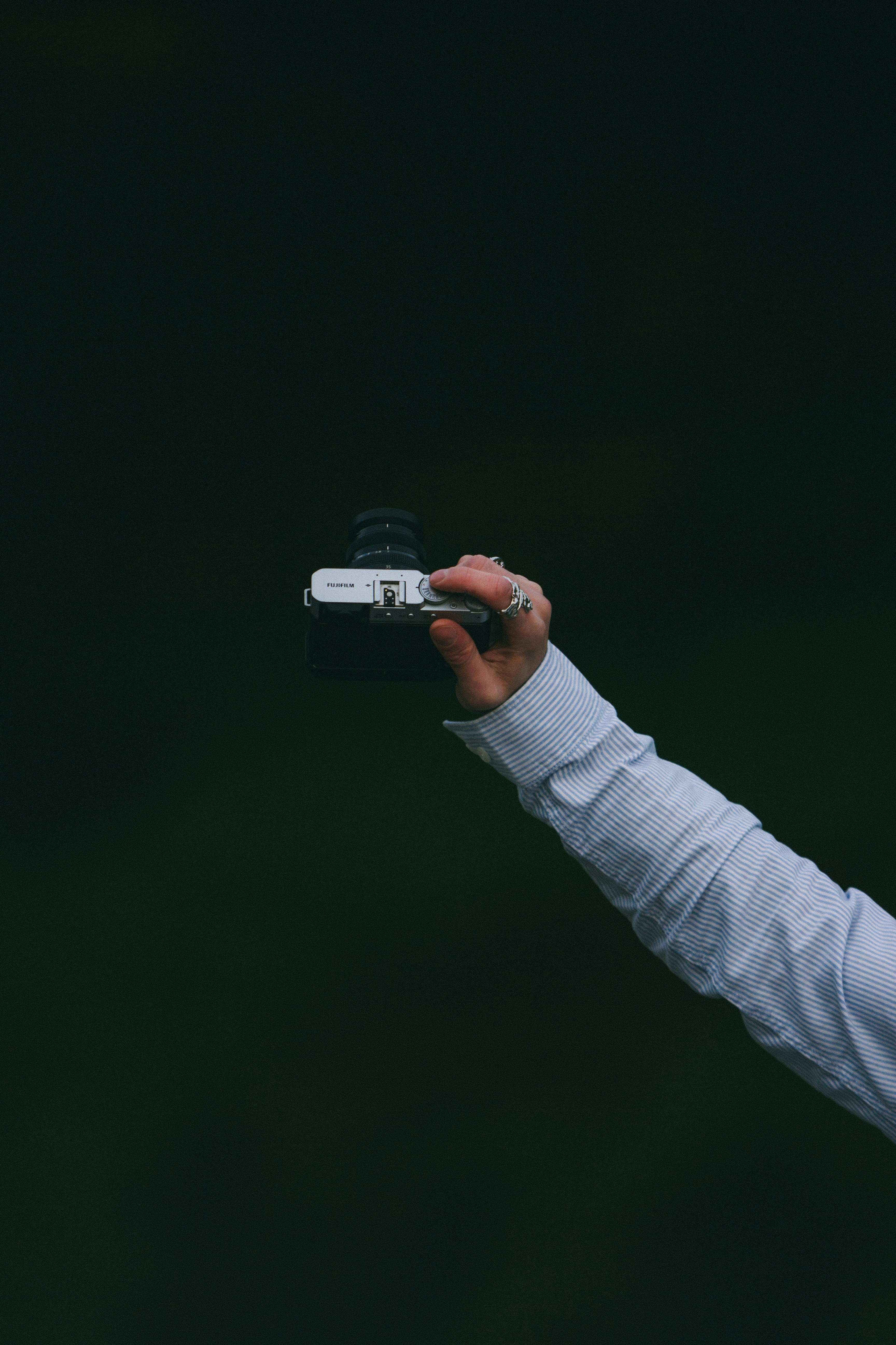 A person taking a picture with a cell phone photo – Free Camera Image ...