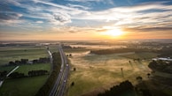 A scenic view of the vegetable fields at sunrise.