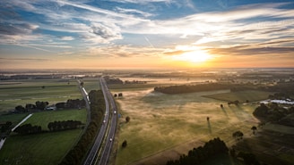 A scenic view of the vegetable fields at sunrise.