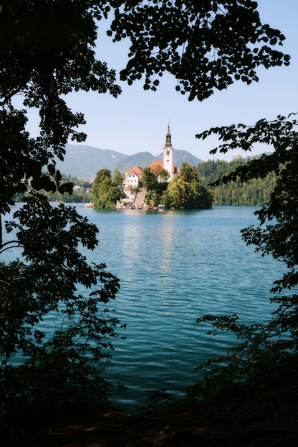 a church on a small island in the middle of a lake