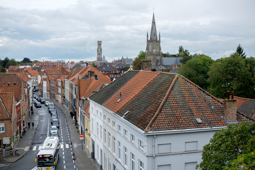 a view of a city street with a bus driving down it