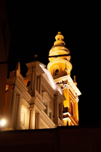 Nighttime shot of the illuminated tower highlighting architectural details.