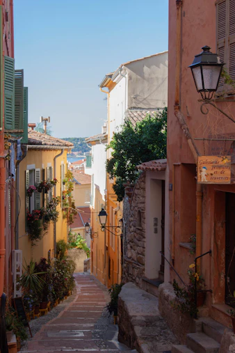 a narrow street with steps leading up to buildings