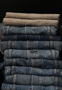 a stack of jeans sitting next to each other