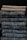 A collection of dress pants in various colors neatly arranged.