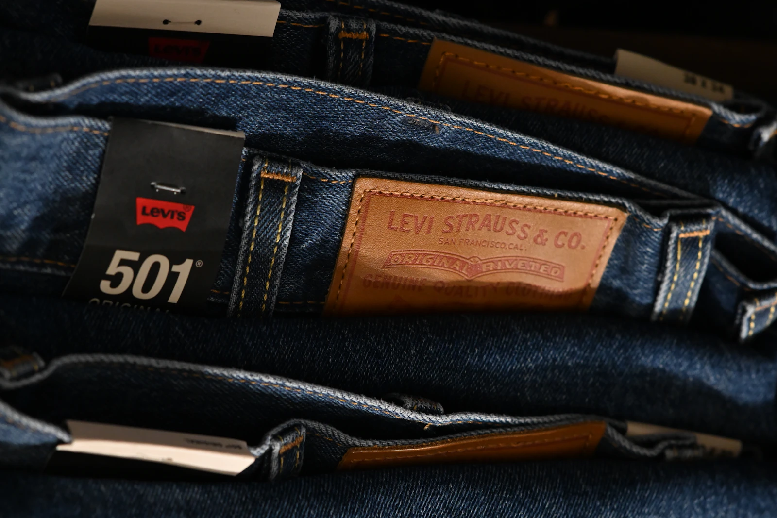 Stack of Levi's 501 jeans with leather patch and 501 tag