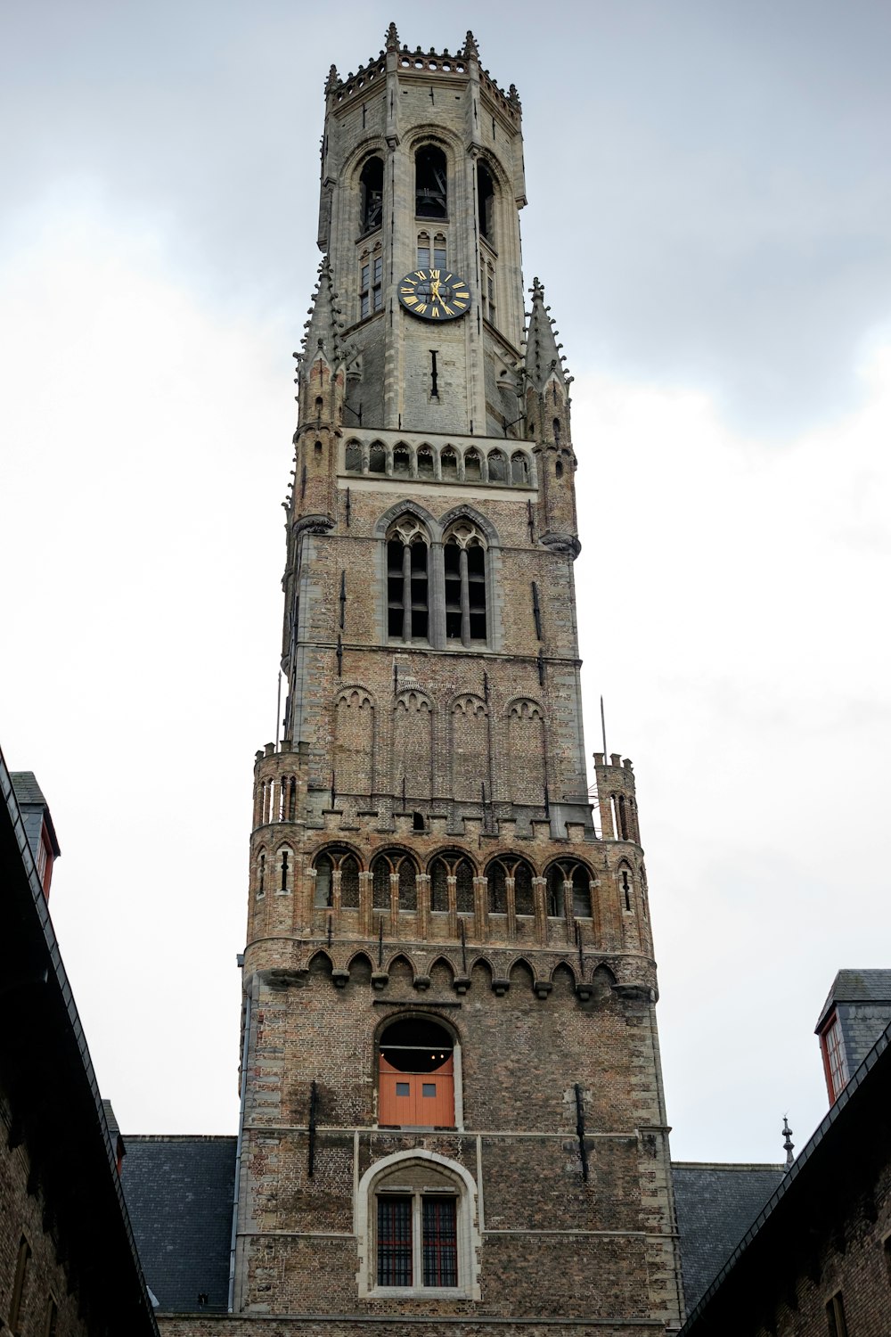 a tall tower with a clock on the top of it