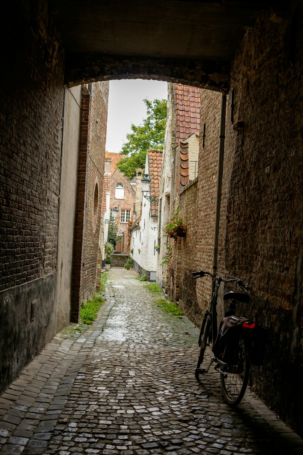 a bike is parked on a cobblestone street